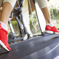 women running on treadmill